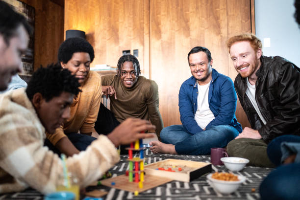 istock Friends playing board game at home 1414873868