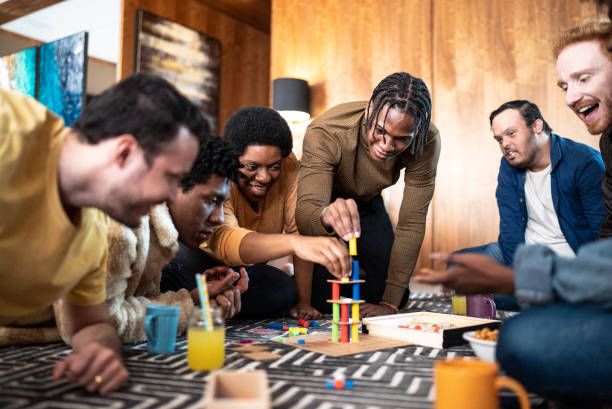 istock Friends playing board game at home 1414873870