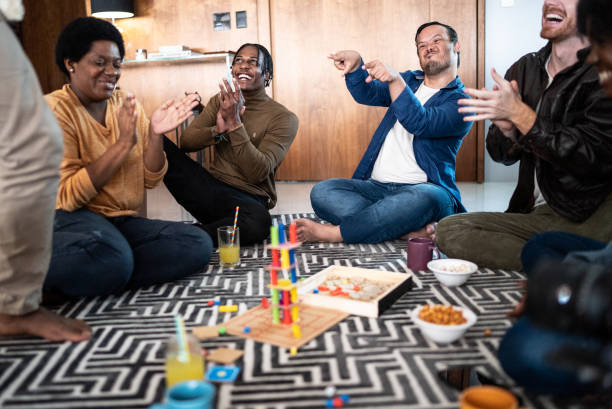 istock Friends playing board game at home 1414873879
