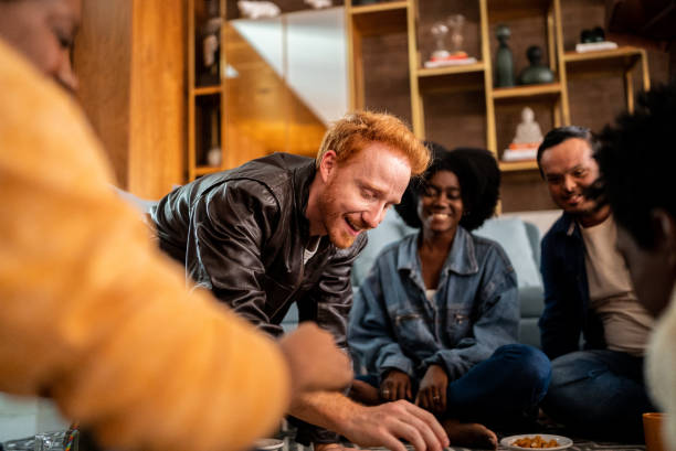 istock Friends playing board game at home 1414873912