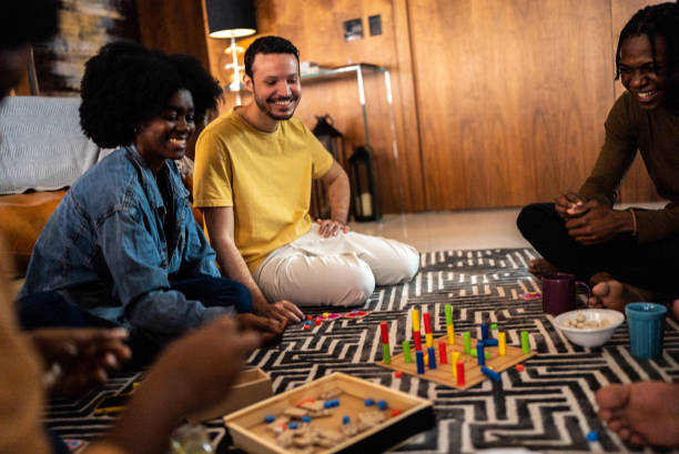 istock Friends playing board game at home 1414874128