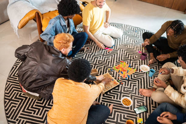 istock Friends playing board game at home 1414874134