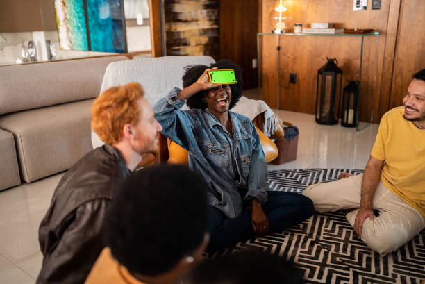 istock Friends playing guessing game at home 1414874718