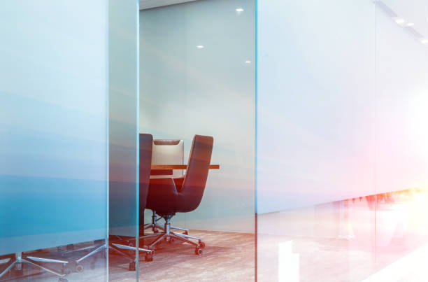 istock Frosted glass wall and armchairs in modern meeting room 1414875183
