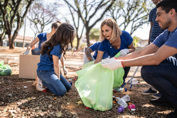 istock People picking up garbage to clean a public park 1414875211
