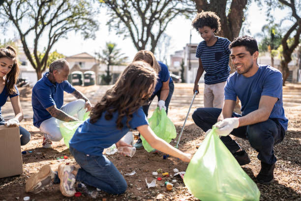 istock People picking up garbage to clean a public park 1414875212