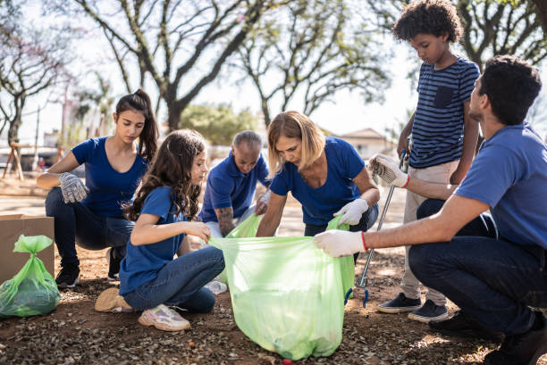 istock People picking up garbage to clean a public park 1414875215