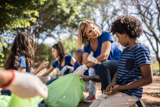 istock People picking up garbage to clean a public park 1414875224
