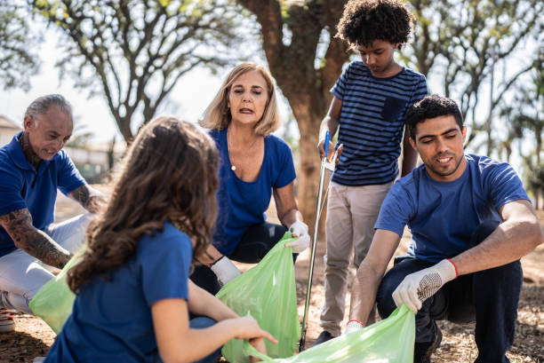 istock People picking up garbage to clean a public park 1414875226