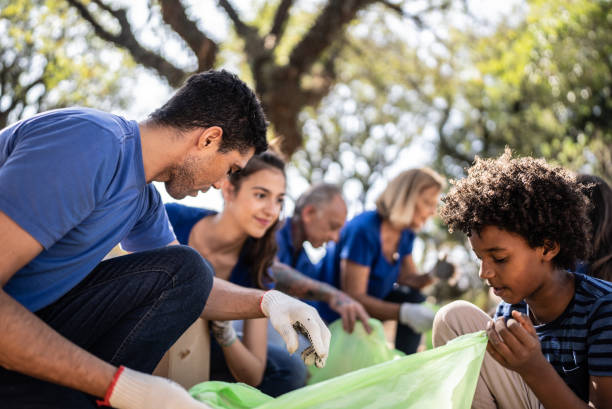 istock People picking up garbage to clean a public park 1414875761