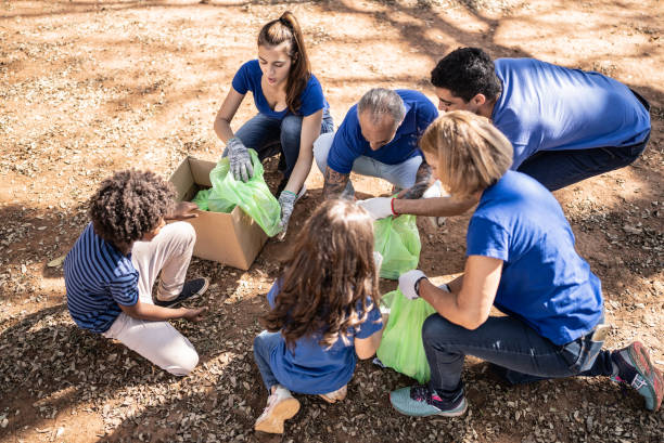 istock People picking up garbage to clean a public park 1414875762