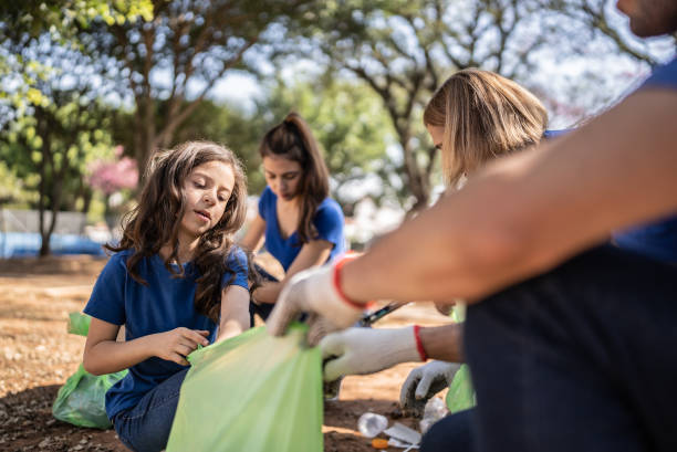 istock People picking up garbage to clean a public park 1414875781