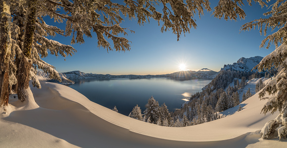 The panoramic view of Crater Lake in partial fog after snow storm