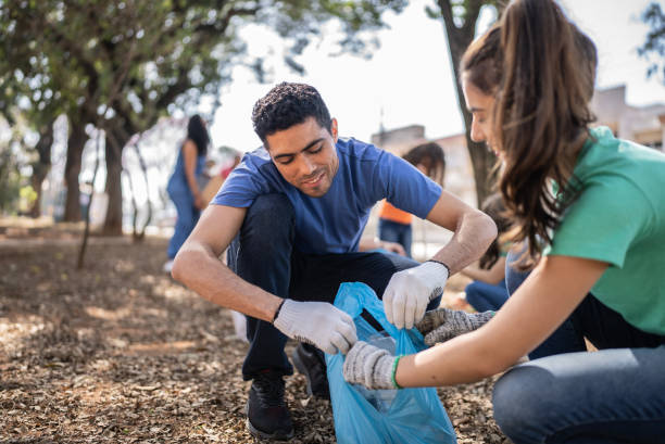 istock People picking up garbage to clean a public park 1414875930