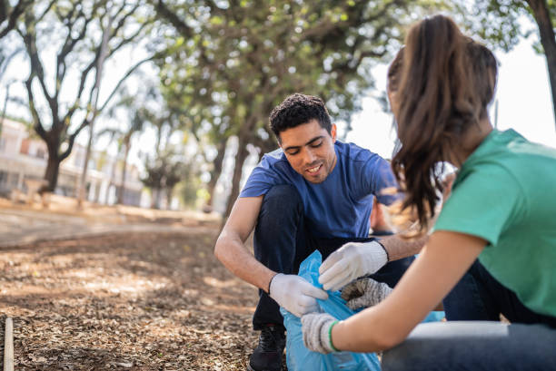 istock People picking up garbage to clean a public park 1414875934