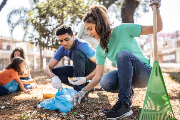 istock People picking up garbage to clean a public park 1414876012