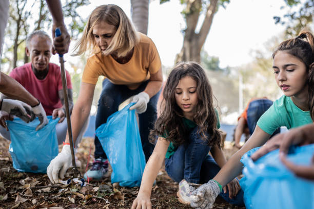 istock People picking up garbage to clean a public park 1414876035