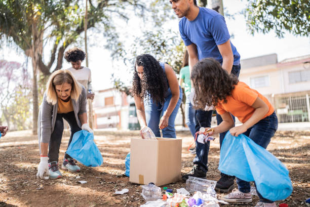 istock People picking up garbage to clean a public park 1414876039