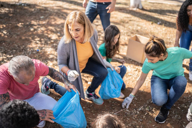 istock People picking up garbage to clean a public park 1414876049