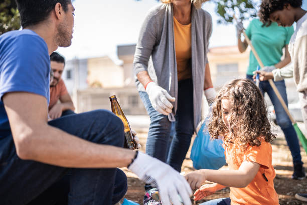 istock People picking up garbage to clean a public park 1414876050