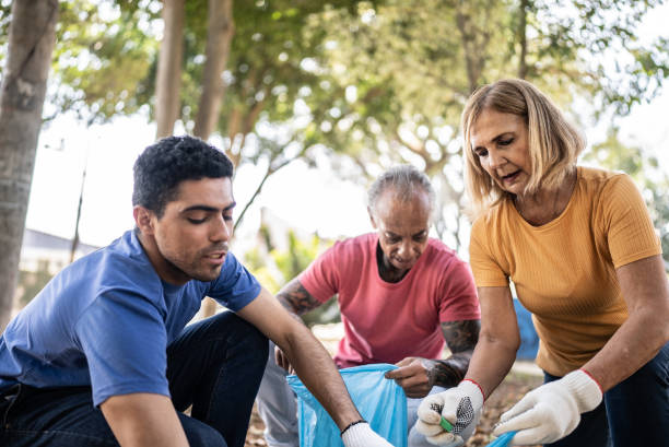 istock People picking up garbage to clean a public park 1414876056