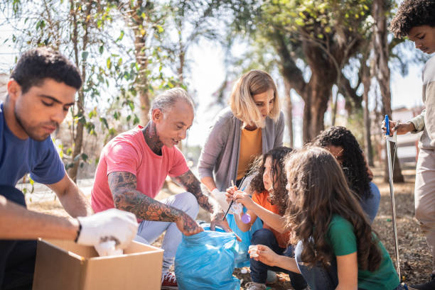 istock People picking up garbage to clean a public park 1414876060
