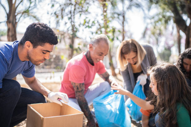 istock People picking up garbage to clean a public park 1414876066