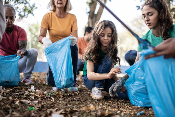 istock People picking up garbage to clean a public park 1414876067