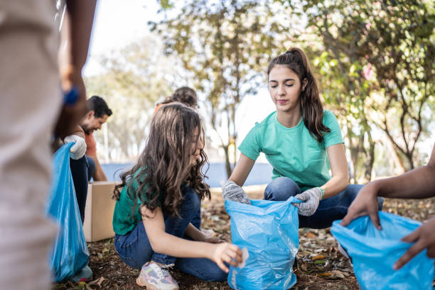 istock People picking up garbage to clean a public park 1414876073