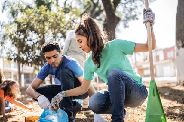 istock People picking up garbage to clean a public park 1414876079