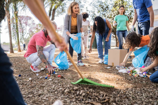 istock People picking up garbage to clean a public park 1414876081