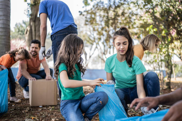 istock People picking up garbage to clean a public park 1414876085