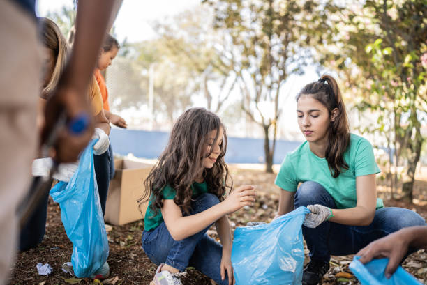 istock People picking up garbage to clean a public park 1414876093