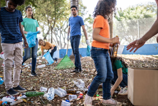 istock People picking up garbage to clean a public park 1414876095