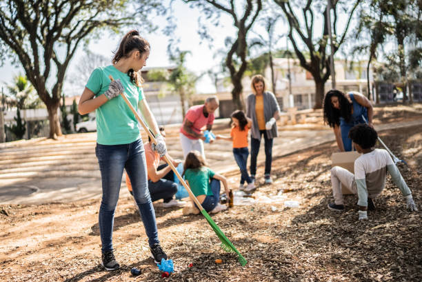 istock People picking up garbage to clean a public park 1414876328