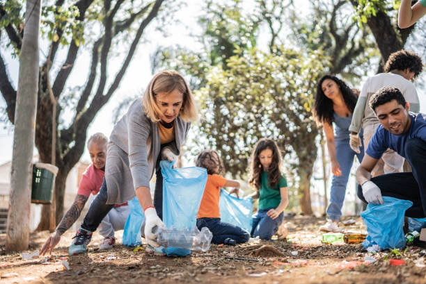 istock People picking up garbage to clean a public park 1414876337