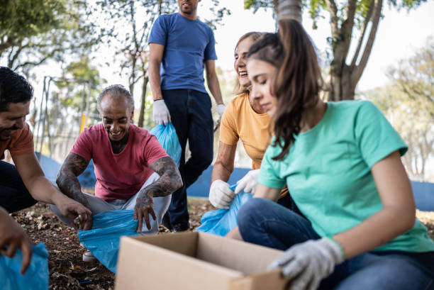 istock People picking up garbage to clean a public park 1414876363