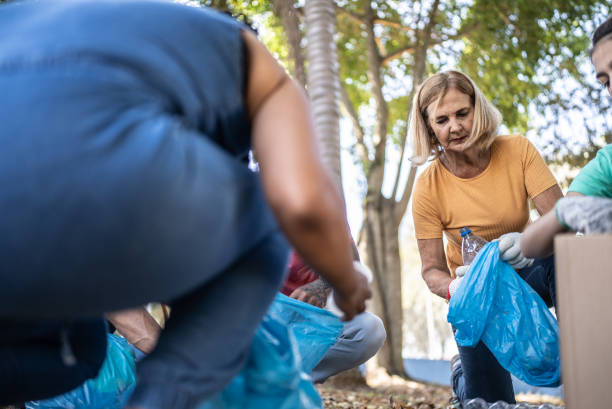 istock People picking up garbage to clean a public park 1414876413