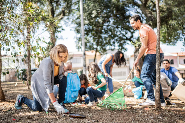 istock People picking up garbage to clean a public park 1414876455