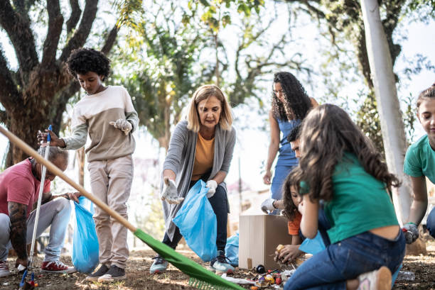 istock People picking up garbage to clean a public park 1414876456