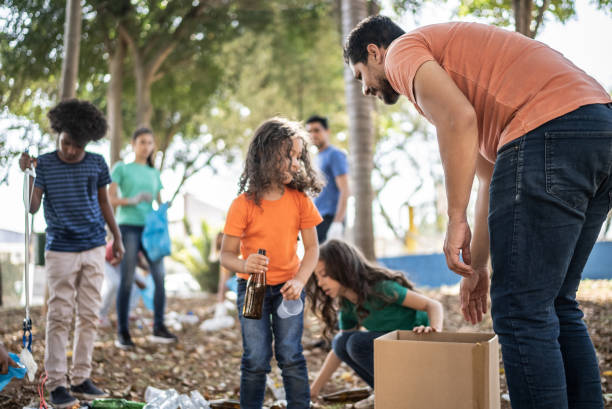 istock People picking up garbage to clean a public park 1414876462