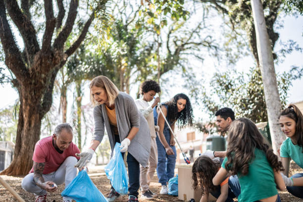 istock People picking up garbage to clean a public park 1414876464