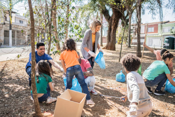 istock People picking up garbage to clean a public park 1414876477