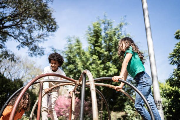 istock Children playing at a public park 1414876503