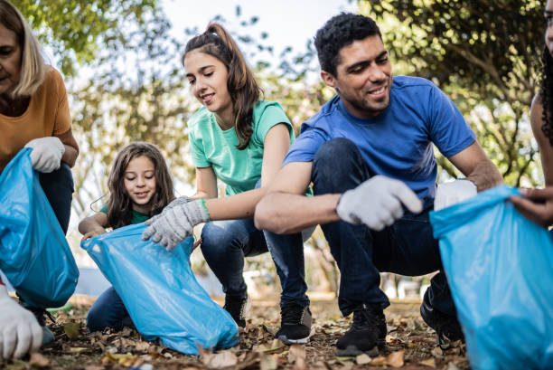 istock People picking up garbage to clean a public park 1414876505