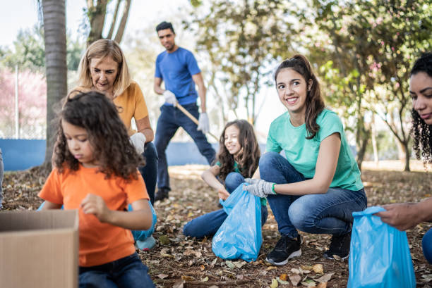istock People picking up garbage to clean a public park 1414876513