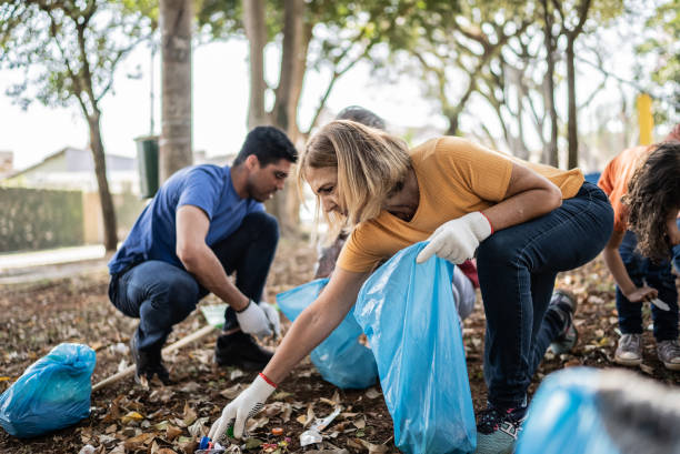 istock People picking up garbage to clean a public park 1414876547