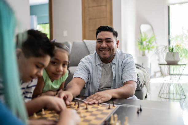 istock Family playing chess and having fun at home 1414877574
