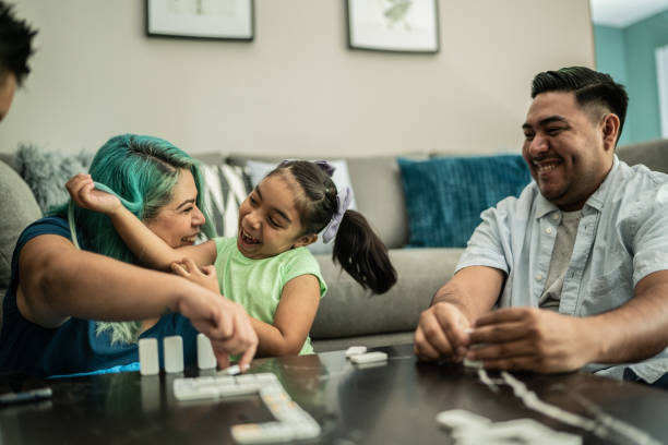 istock Family playing domino at home 1414877633