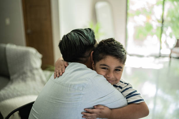 istock Son embracing his father at home 1414877802